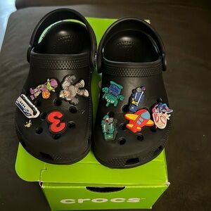 Black crocs with charms